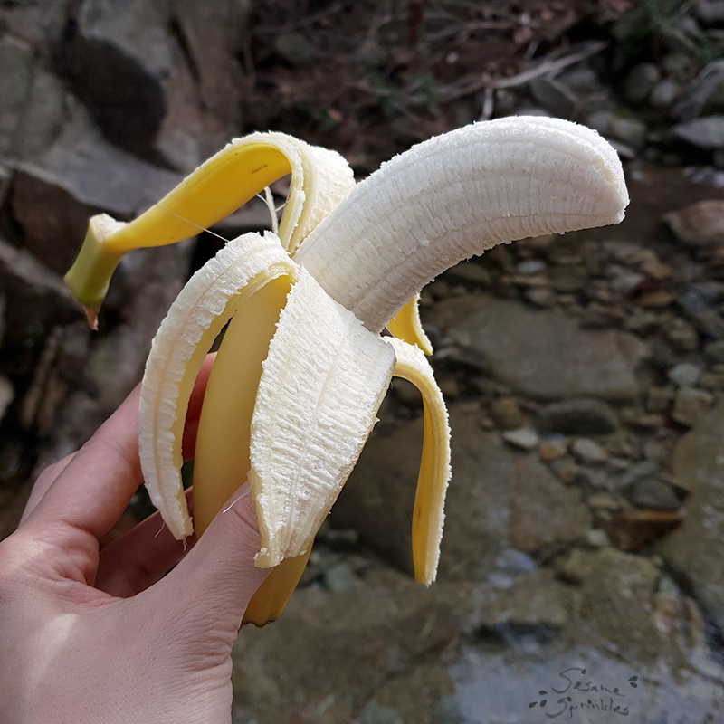 Peeled banana enjoyed during a hike.